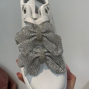 Elegant White Sneakers with Silver Bow Accents